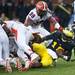Michigan senior quarterback Denard Robinson is hurt trying gain more yards against Illinois on Saturday. Daniel Brenner I AnnArbor.com